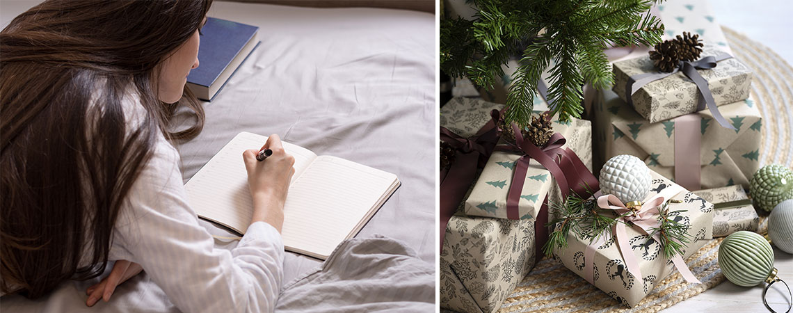 Kvinna som ligger på sängen och skriver en inköpslista och julklappar under granen