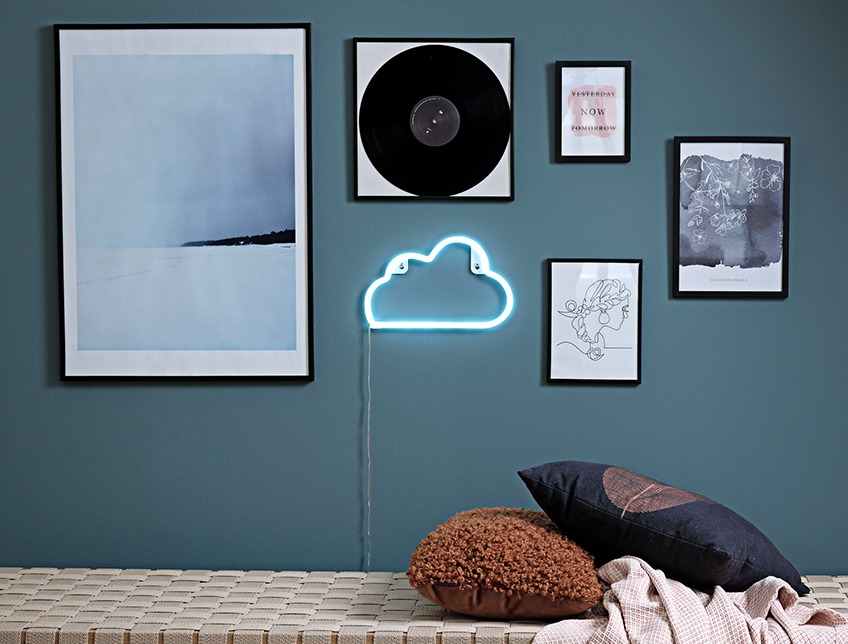 Wall with images in frames and NIELS lamp, shaped as a cloud Wall with images in frames and NIELS lamp, shaped as a cloud