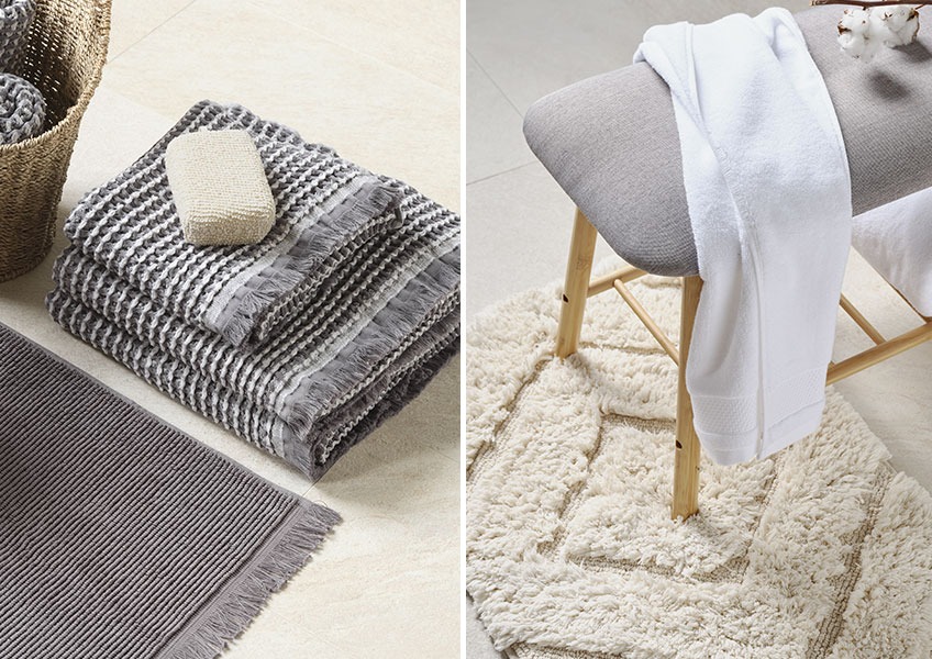 IDRE grå handdukar och GIMO off white badrumsmatta Grå våffeldukar och vit handduk på bänken placerad på vit badrumsmatta